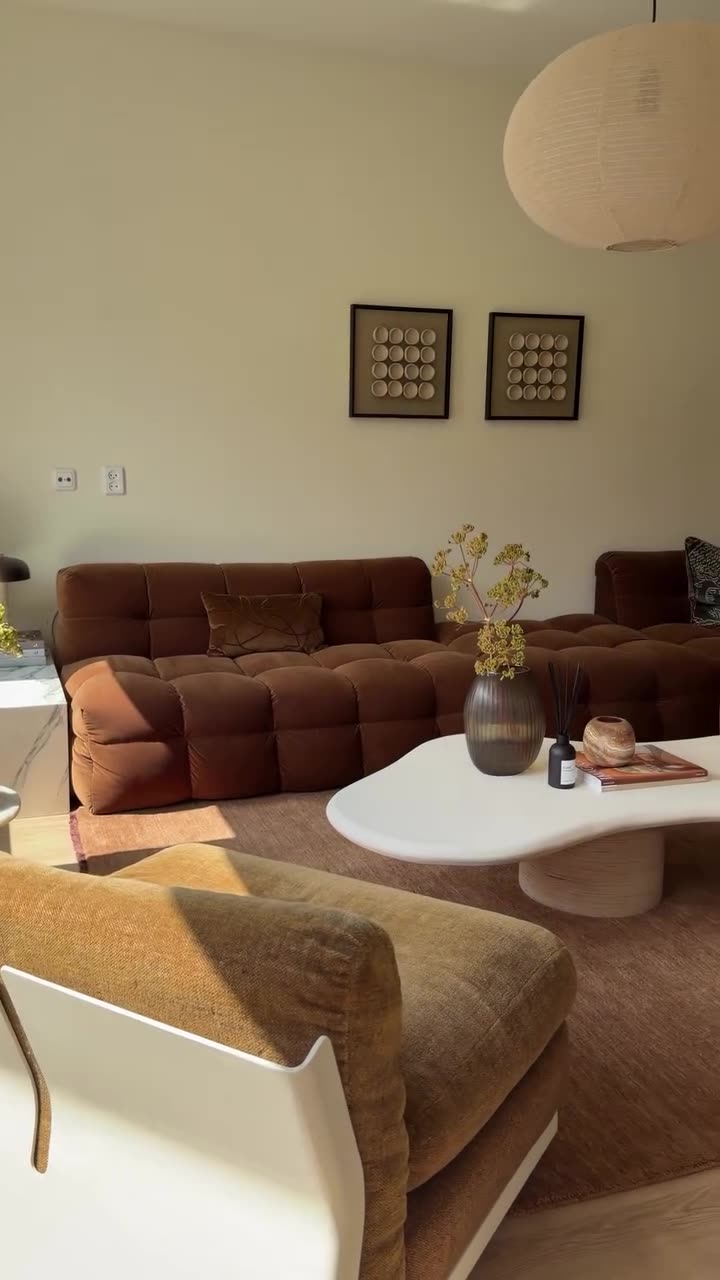 Instagram: Living room with brown sofa and pendant lamp